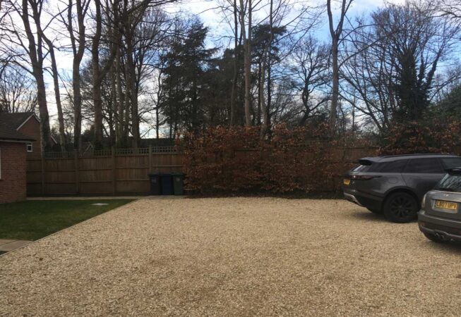 Plain lawn and gravel with beech hedging